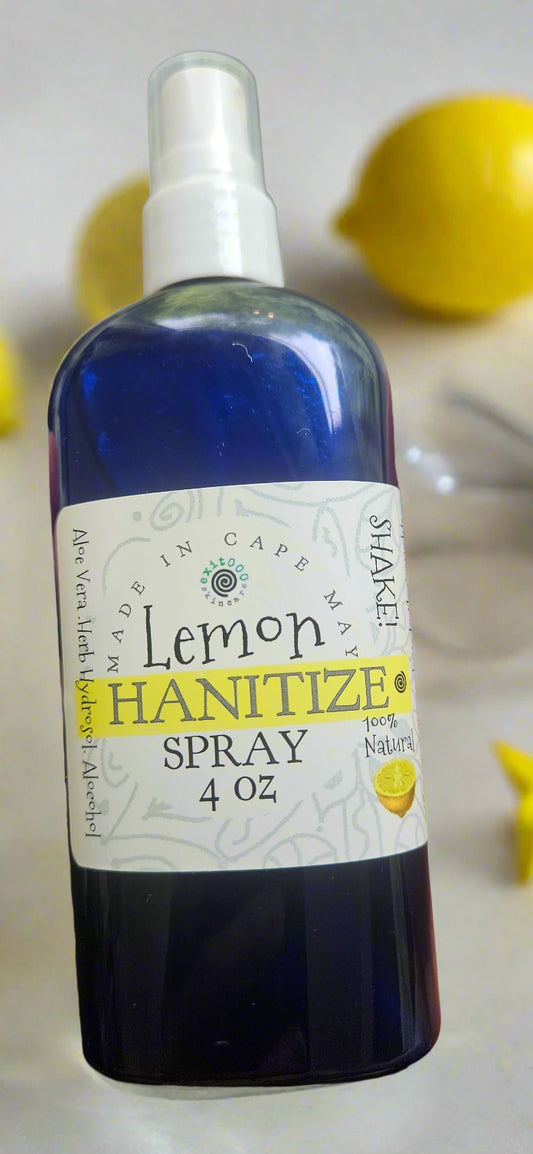 Bottle of lemon hand sanitizer spray held by a person
