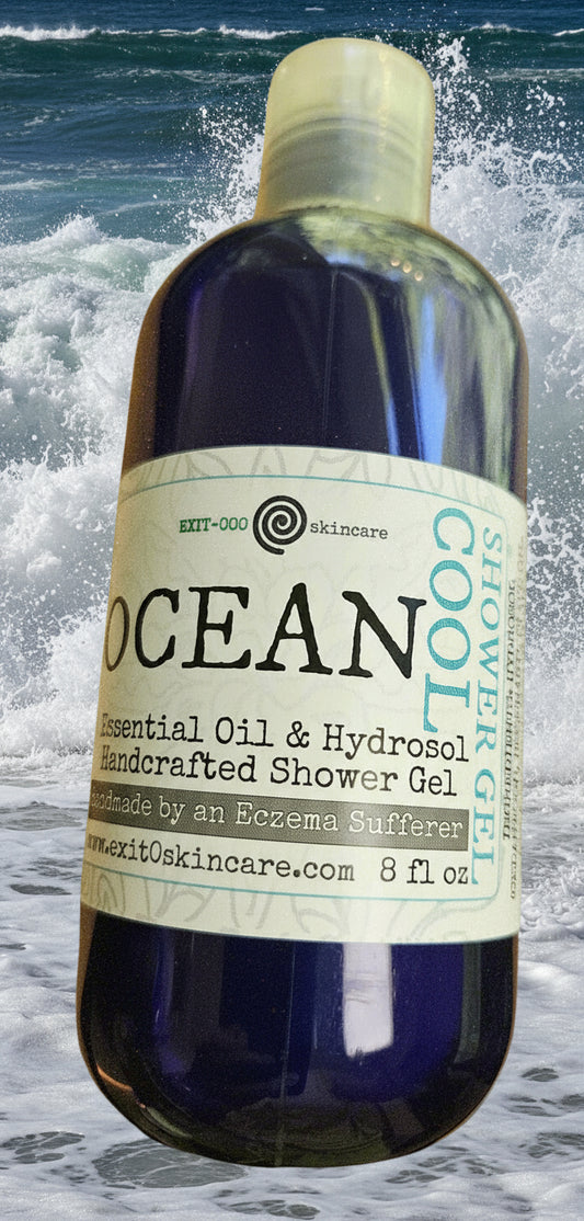 Bottle of 'Ocean' essential oil blend with herb hydrosol shower gel with a label on a neutral background