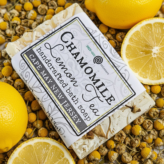 Bar of soap with 'Chamomile Lemon' label on a brown surface