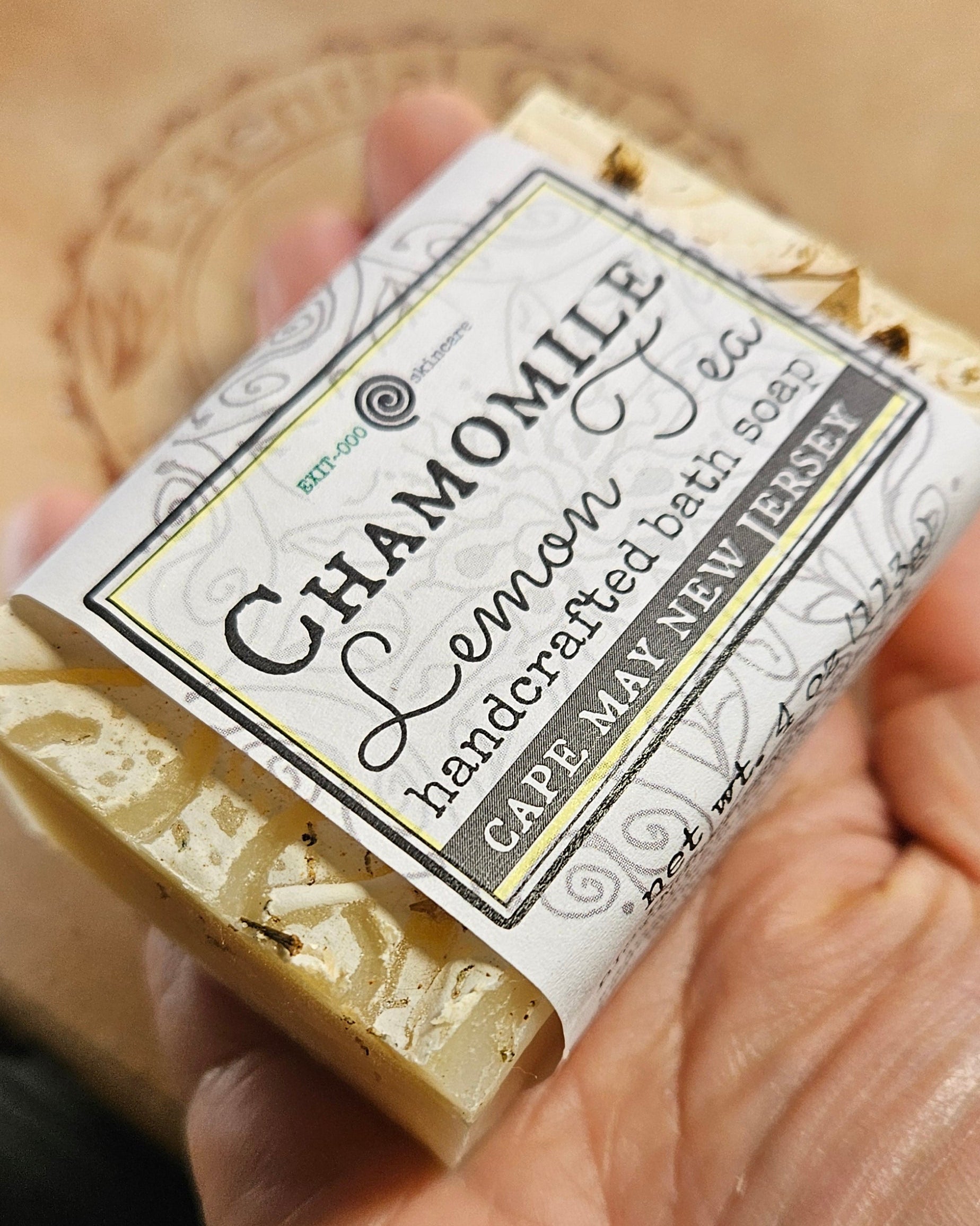 Bar of soap with a label held in a hand