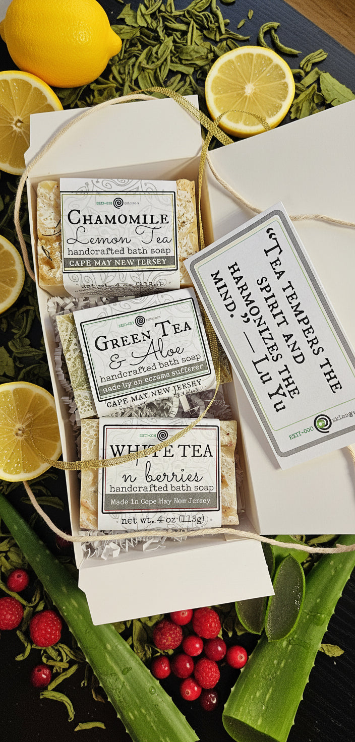Tea packages with decorative labels and a quote on a wooden surface