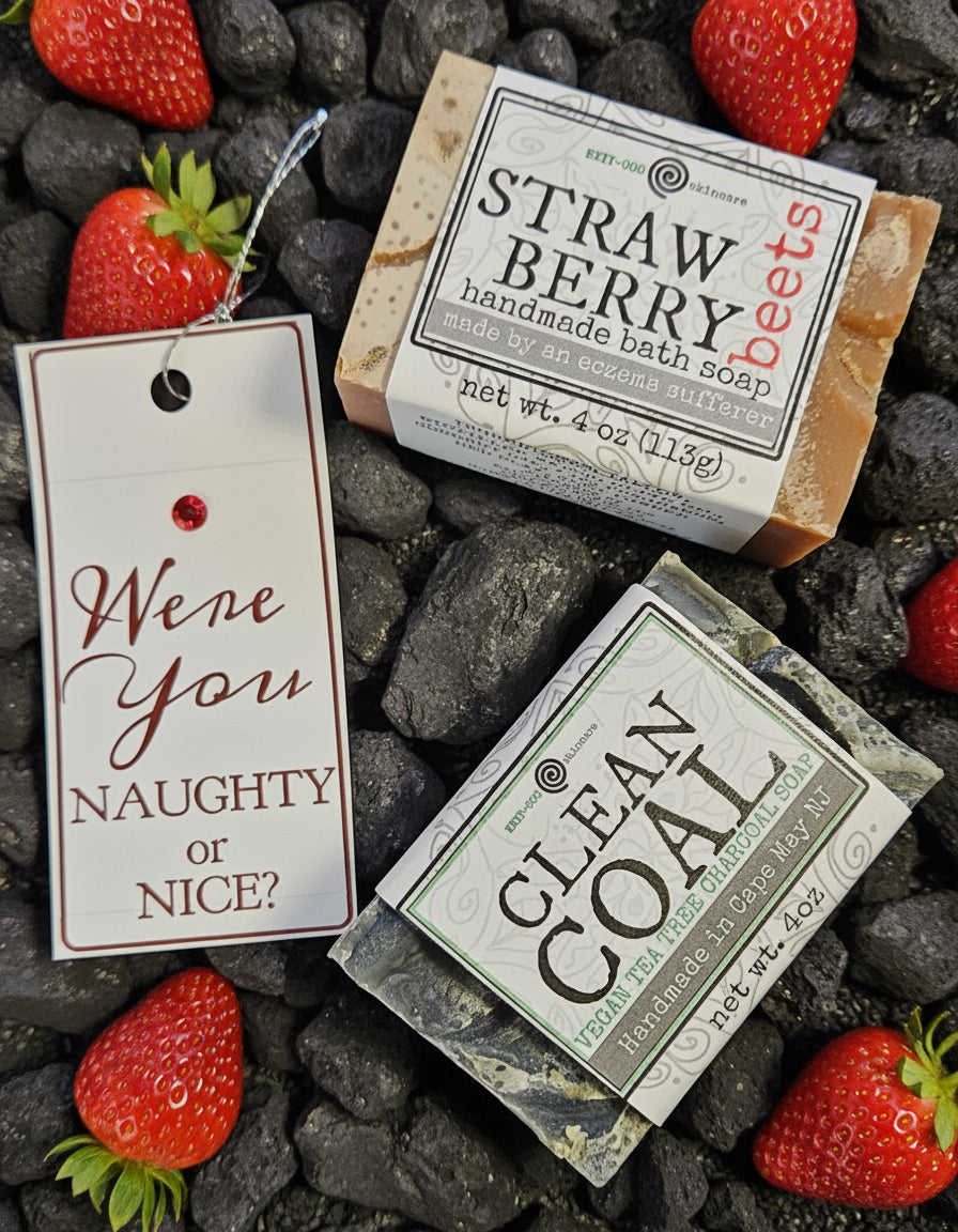Two small packages labeled 'Strawberry' and 'Clean Coal' on a cardboard backing with a decorative tag.