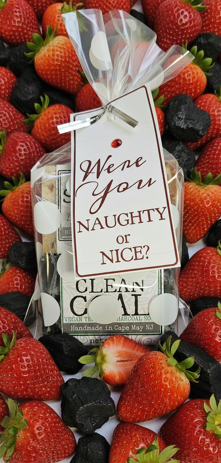 Packaged product with a 'Naughty or Nice?' tag on a wooden surface