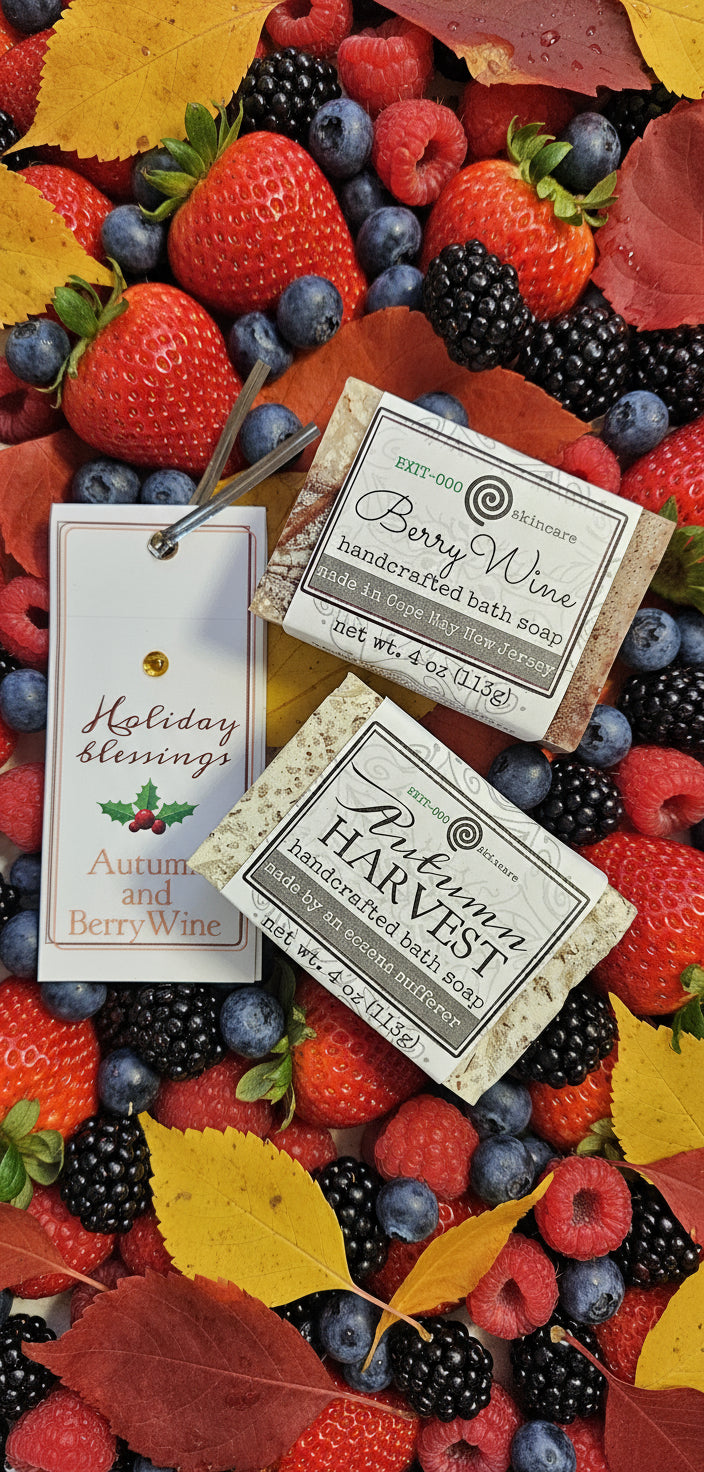Two small boxes labeled 'Berry Wine' and 'Harvest' on a brown surface with a tag.