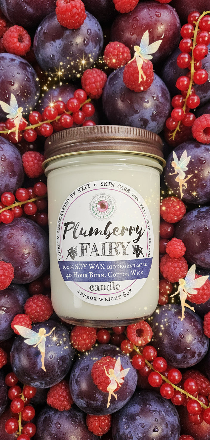 Jar of Plumberry wax candle on a textured surface with stones.