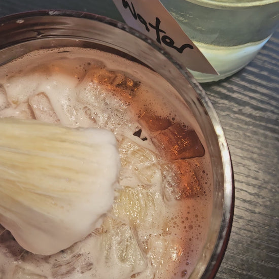 working up a lather with the shaving brush