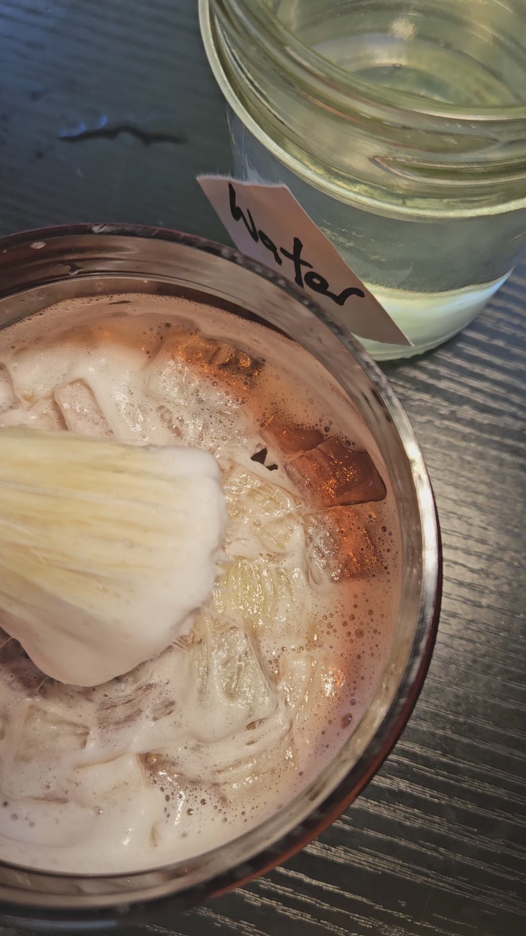 working up a lather with the shaving brush