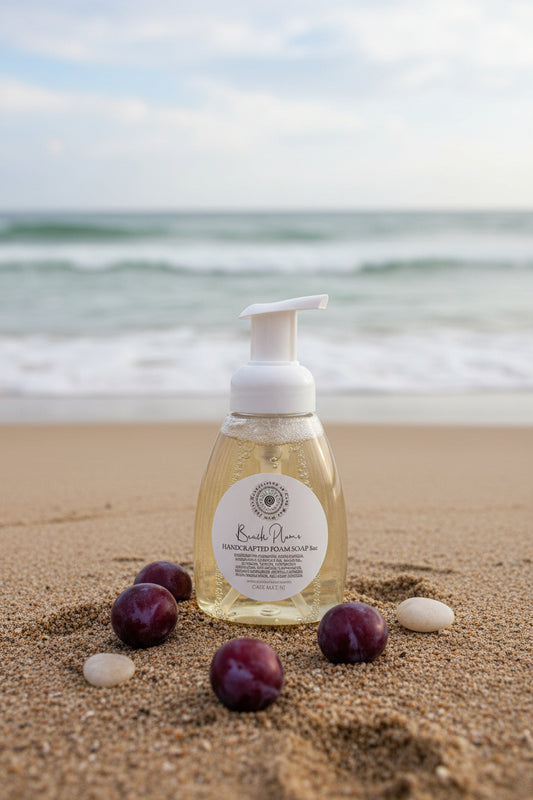 Handcrafted soap bottle with a label on a stone surface