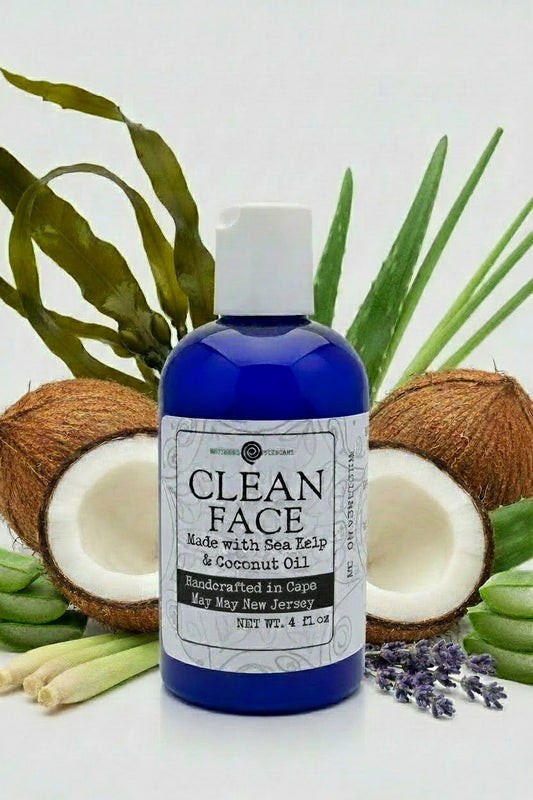 A blue bottle with a white label that reads 'CLEAN FACE Made with Sea Kelp & Coconut Oil'. It is labeled as a skin conditioner and makeup remover.